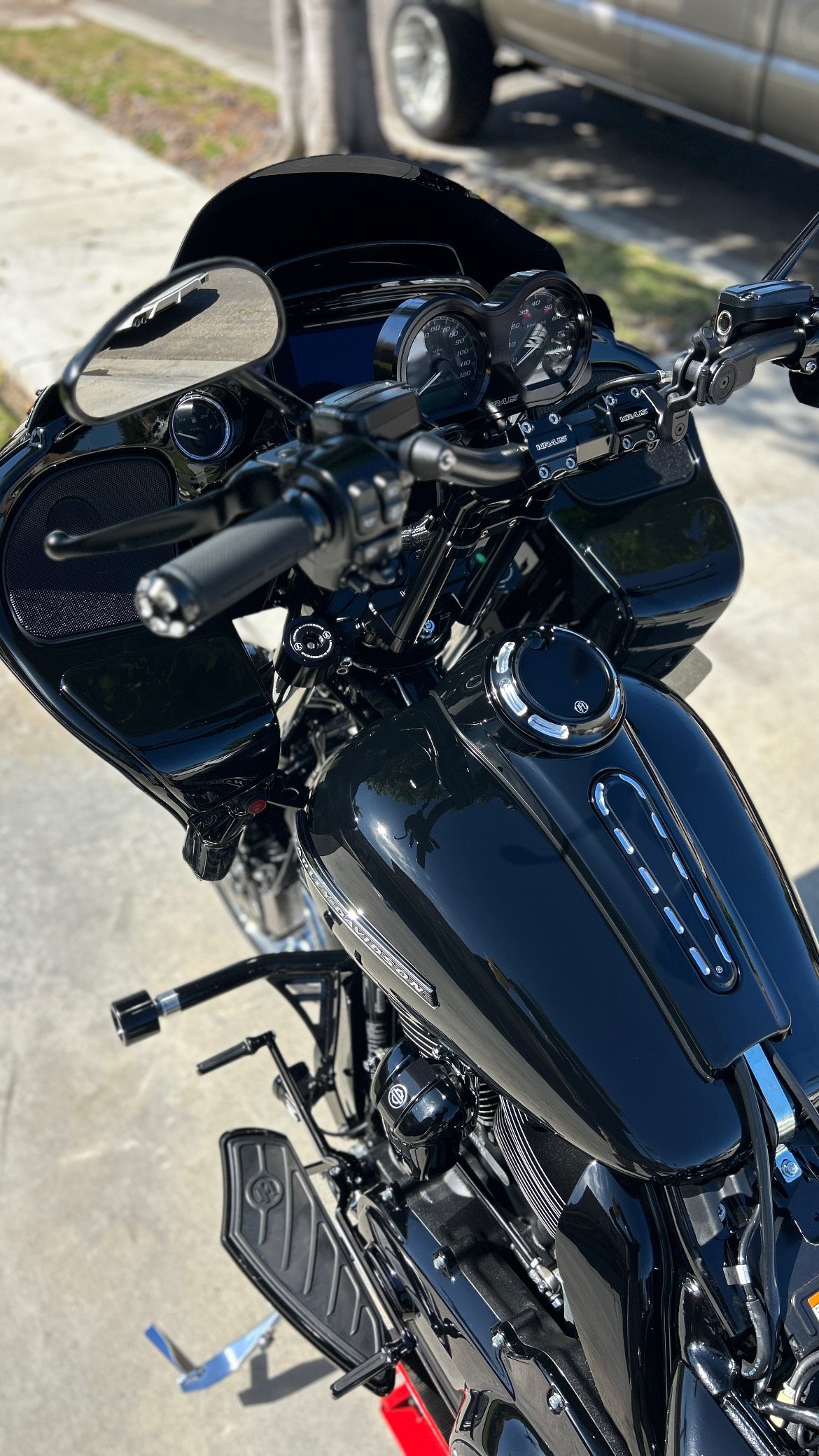 Detailer applying ceramic coating to a blue car